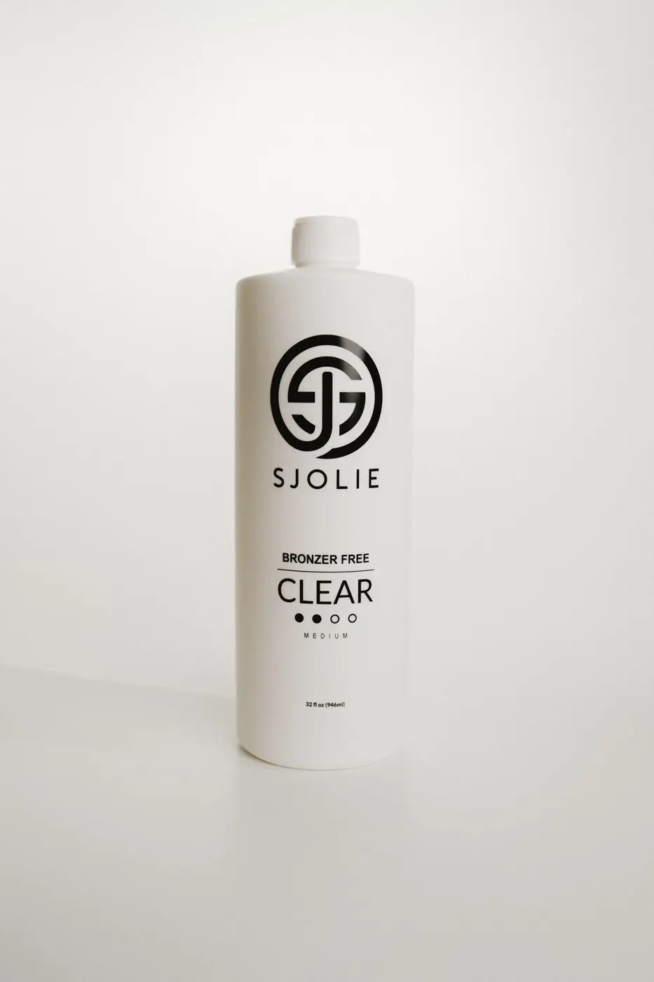 Sjolie Clear N°9 Medium spray tan solution bottle — bronzer-free invisible formula