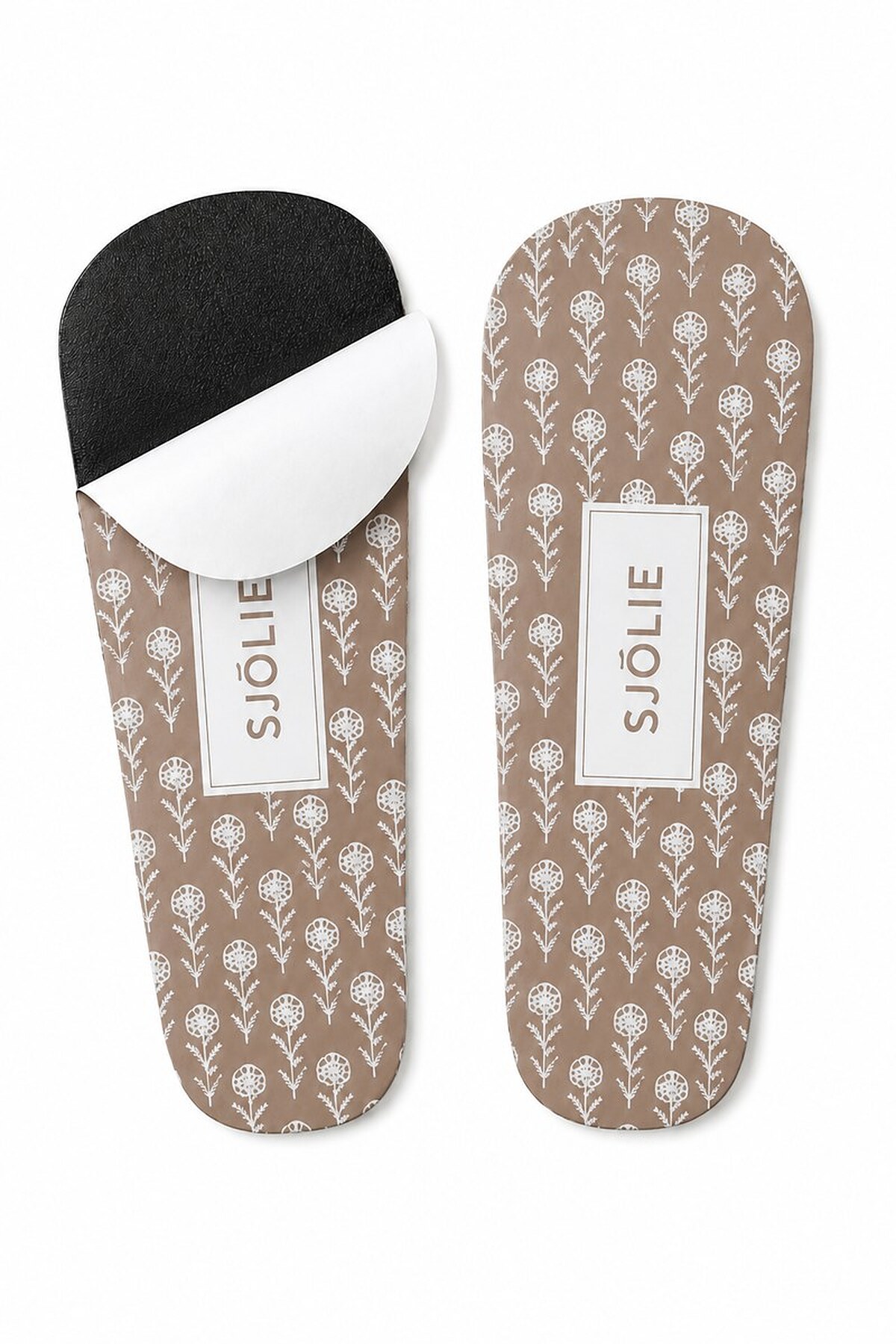 Pair of SJOLIE Sunless Foam Protective Feet, brown patterned sticky feet with one backing peeled back