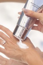 SJOLIE Mineral Defense Sunscreen squeezed onto the back of a hand