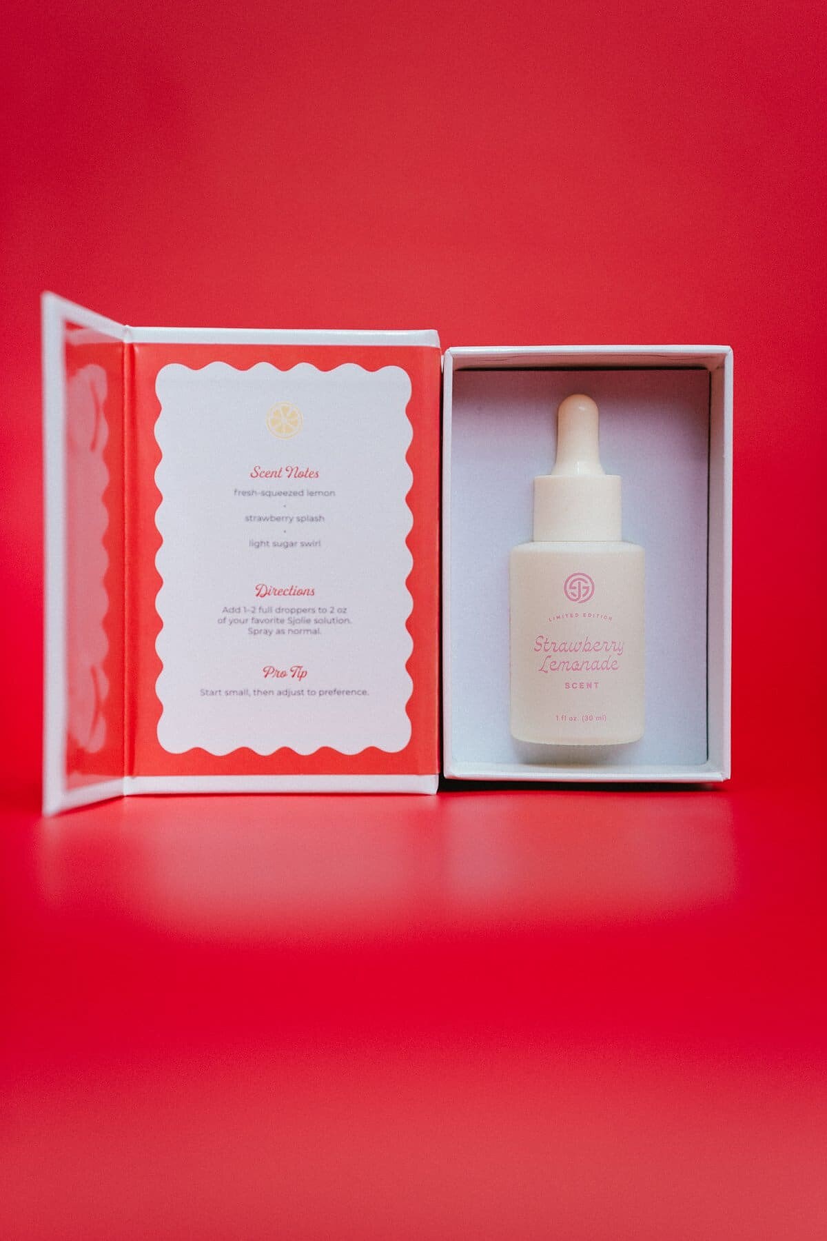 Open SJOLIE Strawberry Lemonade Scent box with the dropper bottle and scent notes card