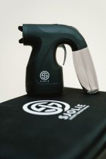Sjolie wireless spray tan gun standing on its branded carrying case