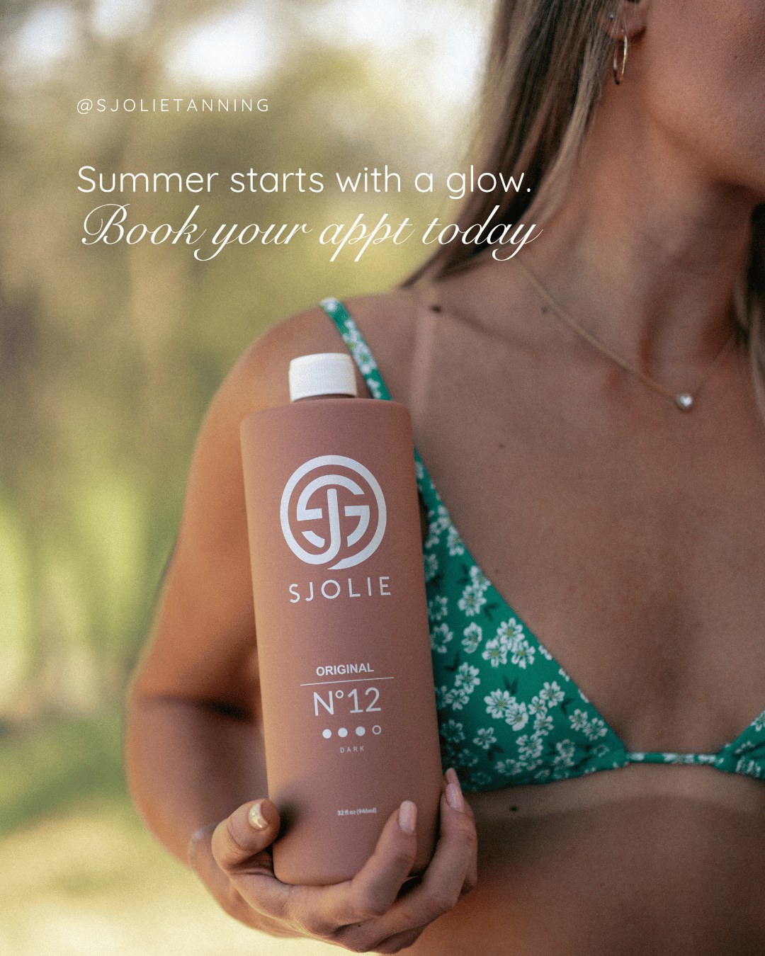 Sjolie Original N°12 Dark — Model holding Original N12 summer-starts-with-a-glow booking ad for spray tan professionals